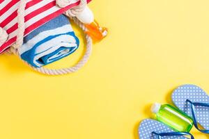 Summer bag background with copy space. Flat lay photo on color table, travel concept.Free space for text, mock-up
