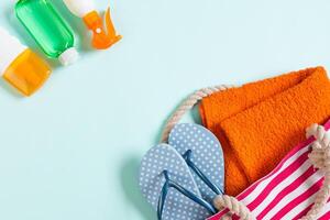 Summer bag background with copy space. Flat lay photo color table, travel concept.Free space for text