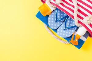 Summer bag background with copy space. Flat lay color table, travel concept. Free space for text photo