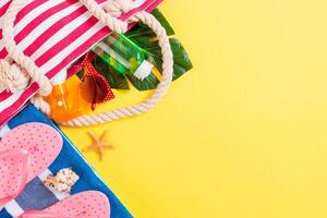 Summer bag with copy space. Flat lay photo on color table, travel concept. Free space for text, mock-up