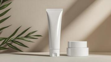 A tube of cream and a container of cream next to a plant photo