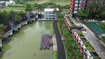 Luxury waterfront resort with modern architecture and lush greenery video