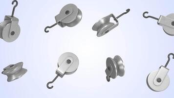 Pulley Blocks Falling on a Light Blue Background. Pulley Wheel with Hooks. 4K video