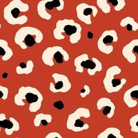 Bold leopard skin seamless pattern. Abstract hand drawn blobs on the red repeat background. Tropical wild print decorated animal skin. Summer illustration for surface, fabric, textile design vector