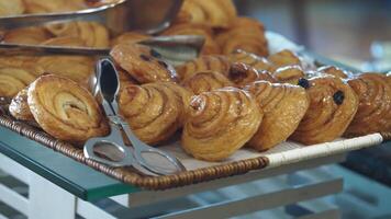 Fresh pastries displayed at a bakery on a sunny morning video