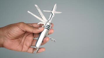 Handheld multi-tool showcases various functions and features video