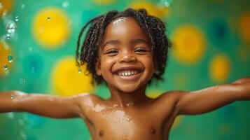 A smiling black child in a playful pose with arms spread wide stands on a green background with figures photo
