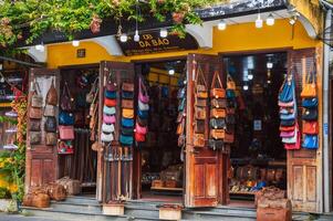 Shop for genuine leather bags and accessories at Hoi An in Market in Asia. Hoi An, Vietnam - December 01, 2024 photo