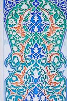 wooden painted background in Museum of Art of Uzbekistan with traditional Uzbek ornaments and oriental patterns photo