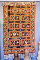 oriental Uzbek carpet with a traditional geometric pattern. Vintage luxury handmade asian carpet in Uzbekistan photo