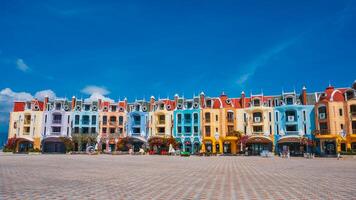 Square with houses and hotels on Vinpearl tourist resort Island in VinWonders Amusement Park in Nha Trang. Nha Trang, Vietnam - March 6, 2025 photo