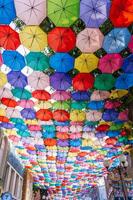 Multicolored bright colorful umbrellas decorate Magic City Park in Tashkent. Tashkent, Uzbekistan - June 15, 2024 photo