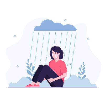 Woman in depression sitting in the rain