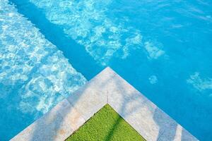 Blue tiles texture in swimming pool. photo
