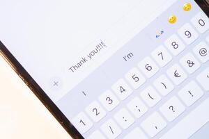 A thank you message on a mobile device. photo
