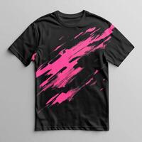 A black and pink t - shirt with a paint brush design photo