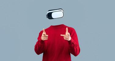 A person uses a virtual reality headset, indicating interaction with a digital environment. The individual is isolated against a neutral background, emphasizing the advanced technology involved. photo
