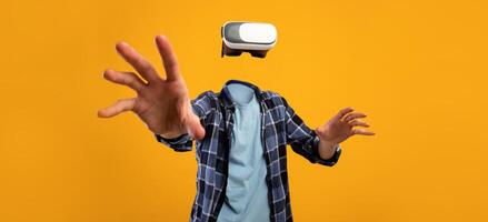 A user engages with virtual reality technology, wearing a headset while reaching out with hands, creating a feeling of immersion. The bright background emphasizes the modern gadget's appeal. photo