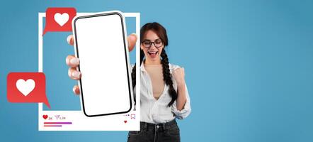 A digital influencer shows excitement by holding a smartphone. The screen displays a blank app, while red heart icons signify engagement and connections online in a bright, isolated background. photo