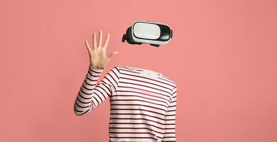 A user engages with virtual reality through a headset, showcasing modern technology. The individual has no visible head or face, emphasizing the immersive experience of augmented environments. photo