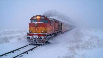 A freight train travels slowly along snowy tracks, pushing through thick fog and winter weather. The train's engine emits smoke, illustrating the challenges of logistics in cold climates. photo