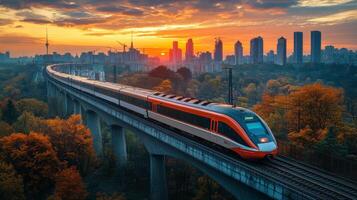 A highspeed train glides along an elevated track as the sun sets, casting warm light over the city skyline and colorful autumn trees, showcasing a blend of technology and nature. photo