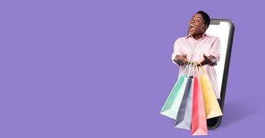A happy buyer interacts with an online store through a smartphone. They are excitedly displaying shopping bags, representing a successful purchase experience, against a vibrant background. photo