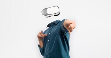 An individual engages with advanced virtual reality technology, wearing a headset that obscures their identity. The person points forward, emphasizing interaction and immersion in digital experiences. photo
