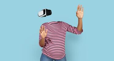 Pregnant lady interacts with a virtual reality device, wearing goggles and moving hands in blank background. The modern technology showcases innovative possibilities in immersive experiences. photo