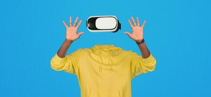 The scene showcases a person wearing advanced virtual reality goggles, actively interacting with a virtual environment. Their hands are prominently displayed, emphasizing the engaged experience. photo