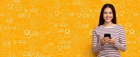 A smiling customer interacts with a delivery service application on her smartphone against a vibrant yellow background filled with relevant icons. She enjoys the convenience of online shopping. photo