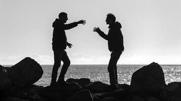 This Two individuals engage in a heated discussion by the shoreline, expressing tension and disagreement. photo