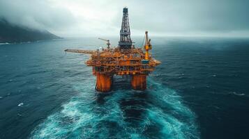 A massive offshore drilling rig towers above turbulent ocean waters, showcasing the extraction of petroleum resources in a remote location under cloudy skies. photo