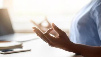 Work Zen. Unrecognizable Black Woman Meditating At Workplace, Closeup Of Female Hands Making Mudra Gesture, Practicing Yoga And Relaxing At Desk Wit Laptop Computer, Coping With Job Stress, Side View photo