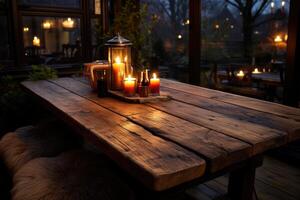 A table with candles and a bottle of wine photo