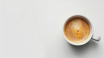 A cup of coffee on a white surface photo