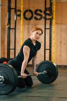 Beautiful strong woman is in the gym., photo