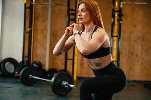Warm ,up exercises. Beautiful ,strong woman is in the gym photo