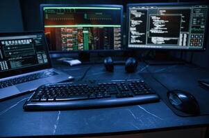 Keyboard and screens. Cyber ,criminal haker, dark room for massive attack of corporate big data servers photo