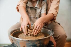 Making ,the pot out of clay. Mother, with, little girl doing pottery at home photo