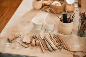 Pottery tools. Close, up view, of the table with instruments photo