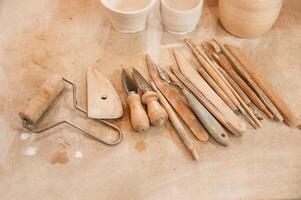 Pottery, tools.. Close up view of the table with instruments photo
