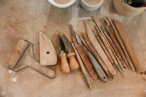 Pottery tools. Close ,up view of the table with instruments photo