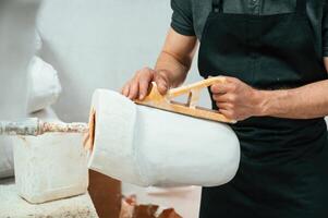 Raw ,product for prosthesis.. Technician working in modern laboratory photo