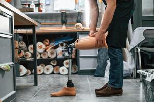 Prosthesis ,on the, floor. Technician working in modern laboratory photo
