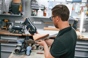 Measuring the ,prosthesis. Technician, working in modern laboratory photo
