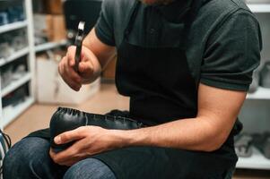 With shoe for prosthesis. ,Technician working in modern laboratory photo