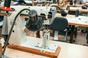 Close up view of sewing machine on the table photo