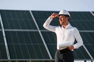 Man ,is doing operating ,and maintenance in solar power plant photo