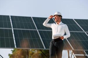 Man, is ,doing operating and maintenance in solar power plant photo